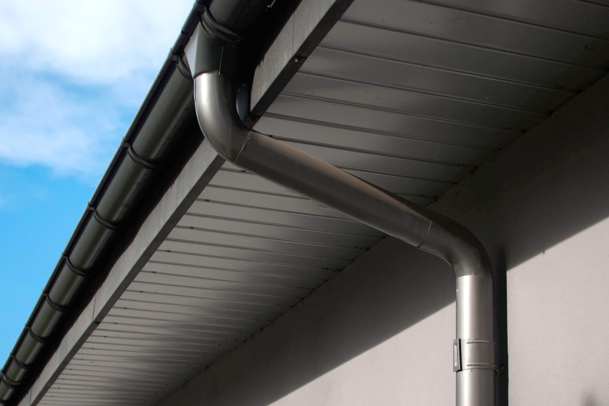 Corrosion-resistant galvanized gutters installed on a commercial building in Summerville
